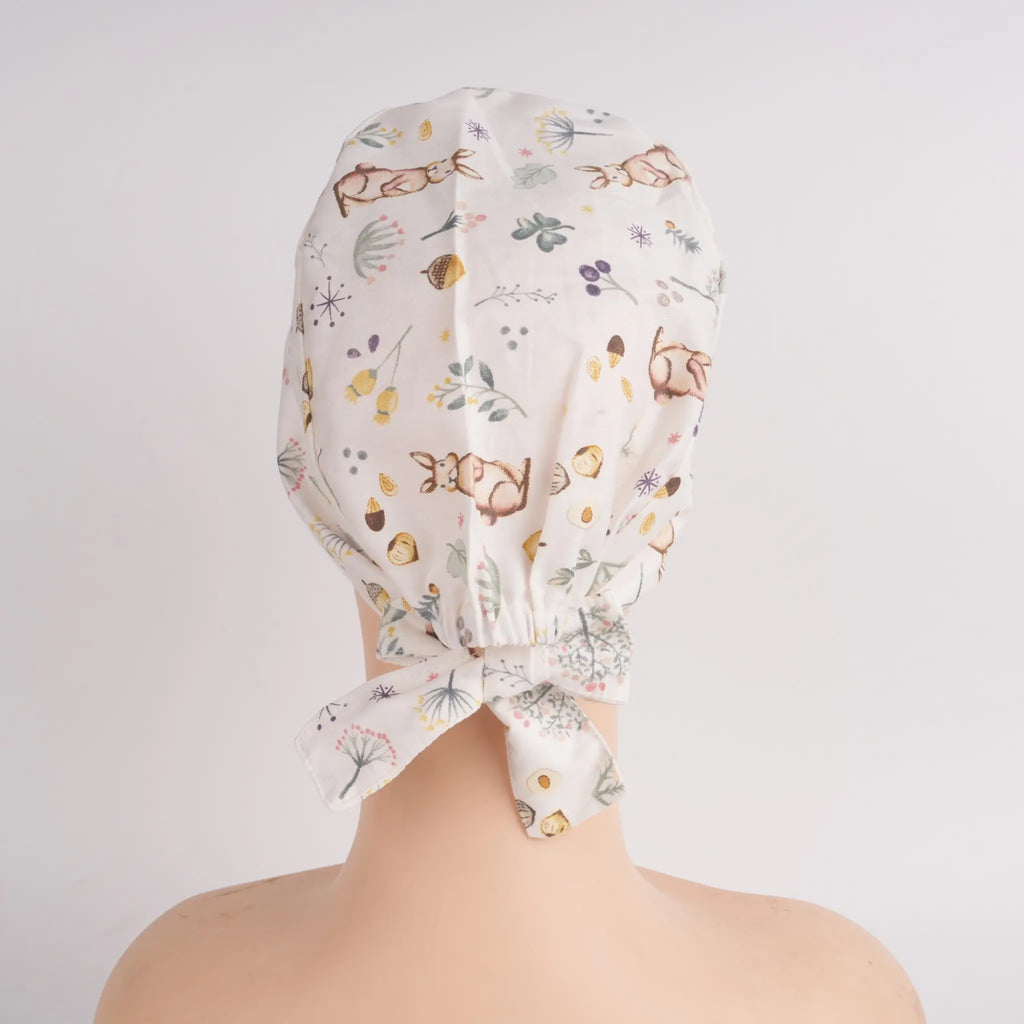 White rabbit and botanical print tie back scrub hat, back view with tie detail
