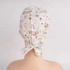 White rabbit and botanical print tie back scrub hat, back view with tie detail
