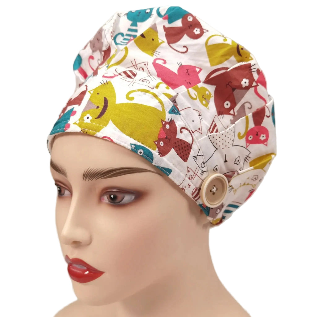 Right front view of colorful cartoon cat print bouffant cap on mannequin head