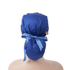 Back view of solid deep blue ponytail scrub cap with tie bow on a mannequin head