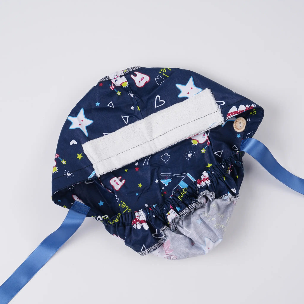 Interior view of navy blue dental scrub cap showing white sweat-absorbing band, elastic pouch.