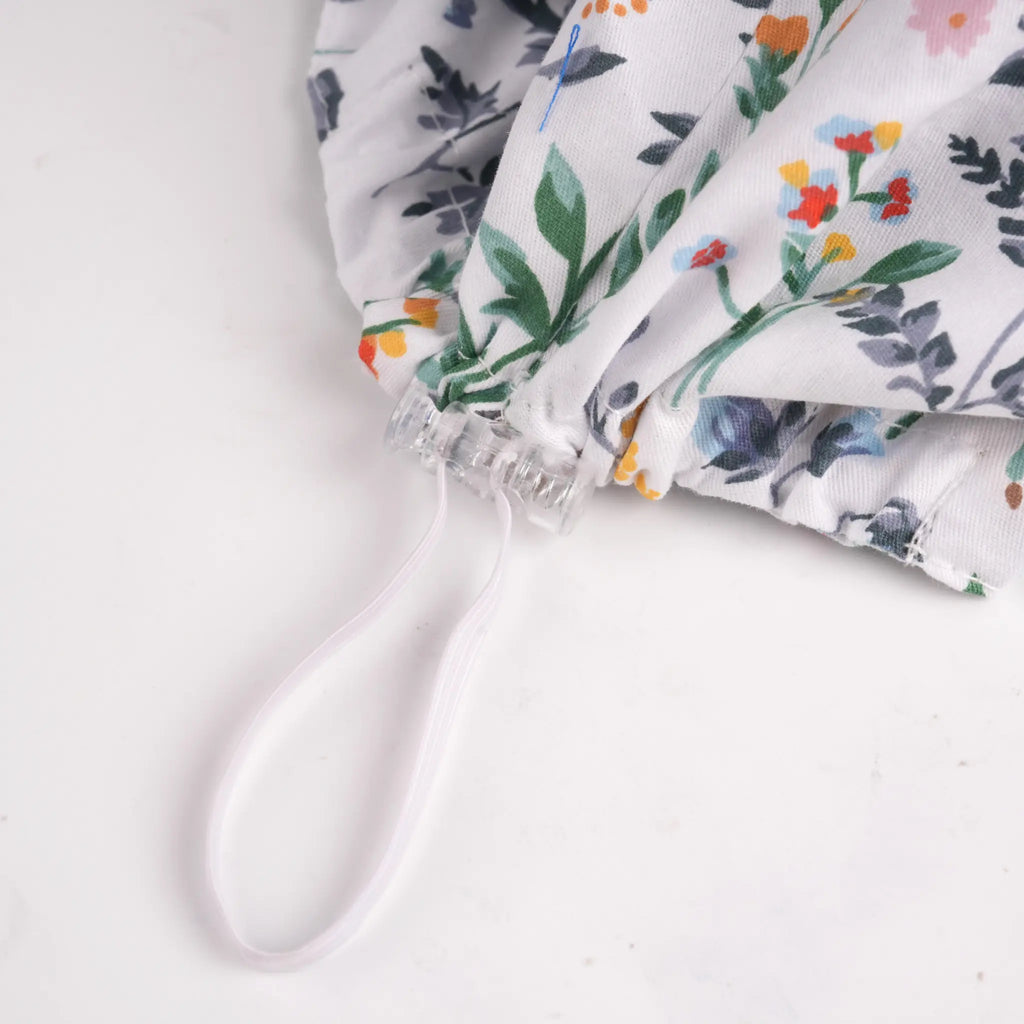 White green botanical euro scrub cap adjustable toggle close-up