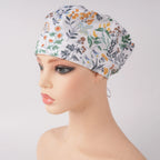 White green botanical print euro scrub cap, front view on mannequin