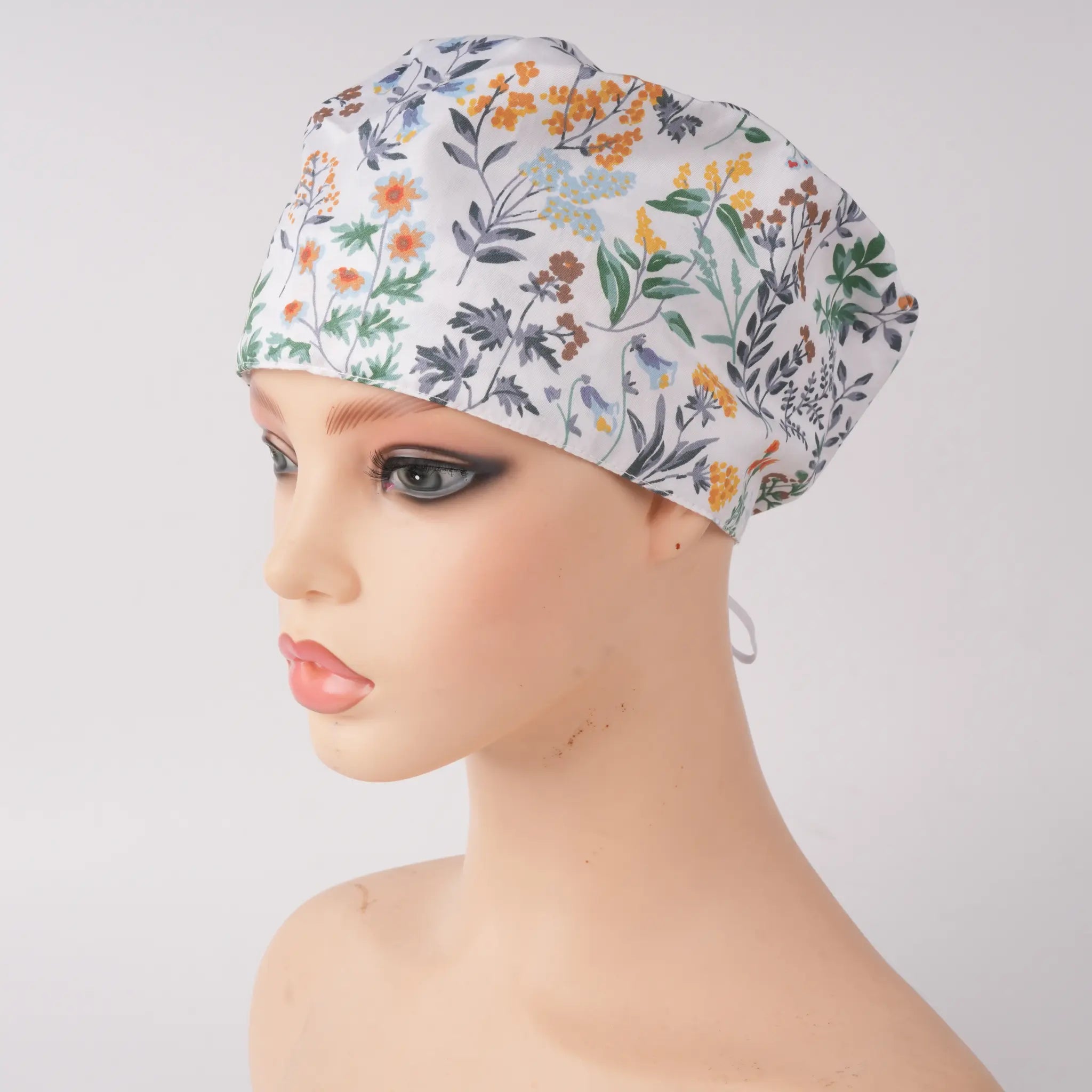 White green botanical print euro scrub cap, front view on mannequin