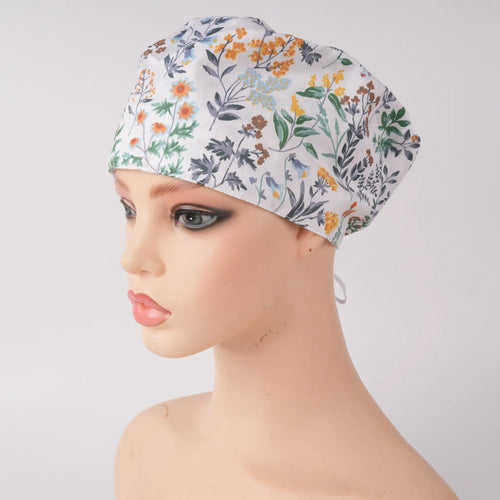 White green botanical print euro scrub cap, front view on mannequin