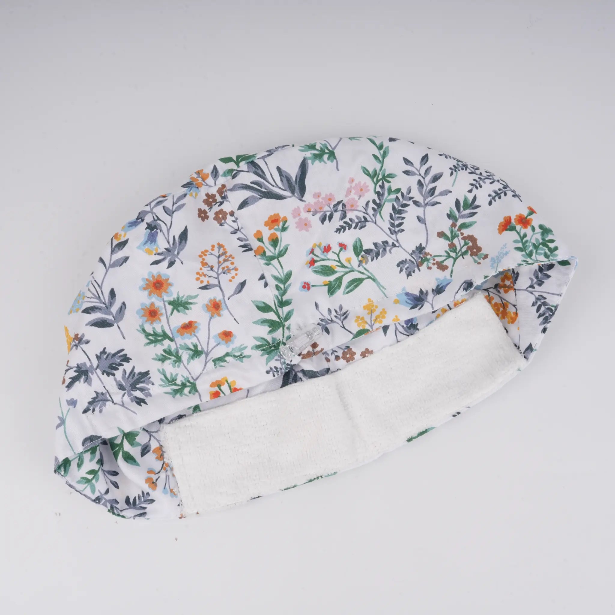 Close-up of forehead sweatband on botanical print euro cap.