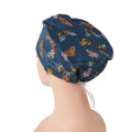 Side back view of navy butterfly euro cap on mannequin head
