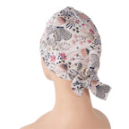 Side back view of gray butterfly tie back scrub cap with pink flowers
