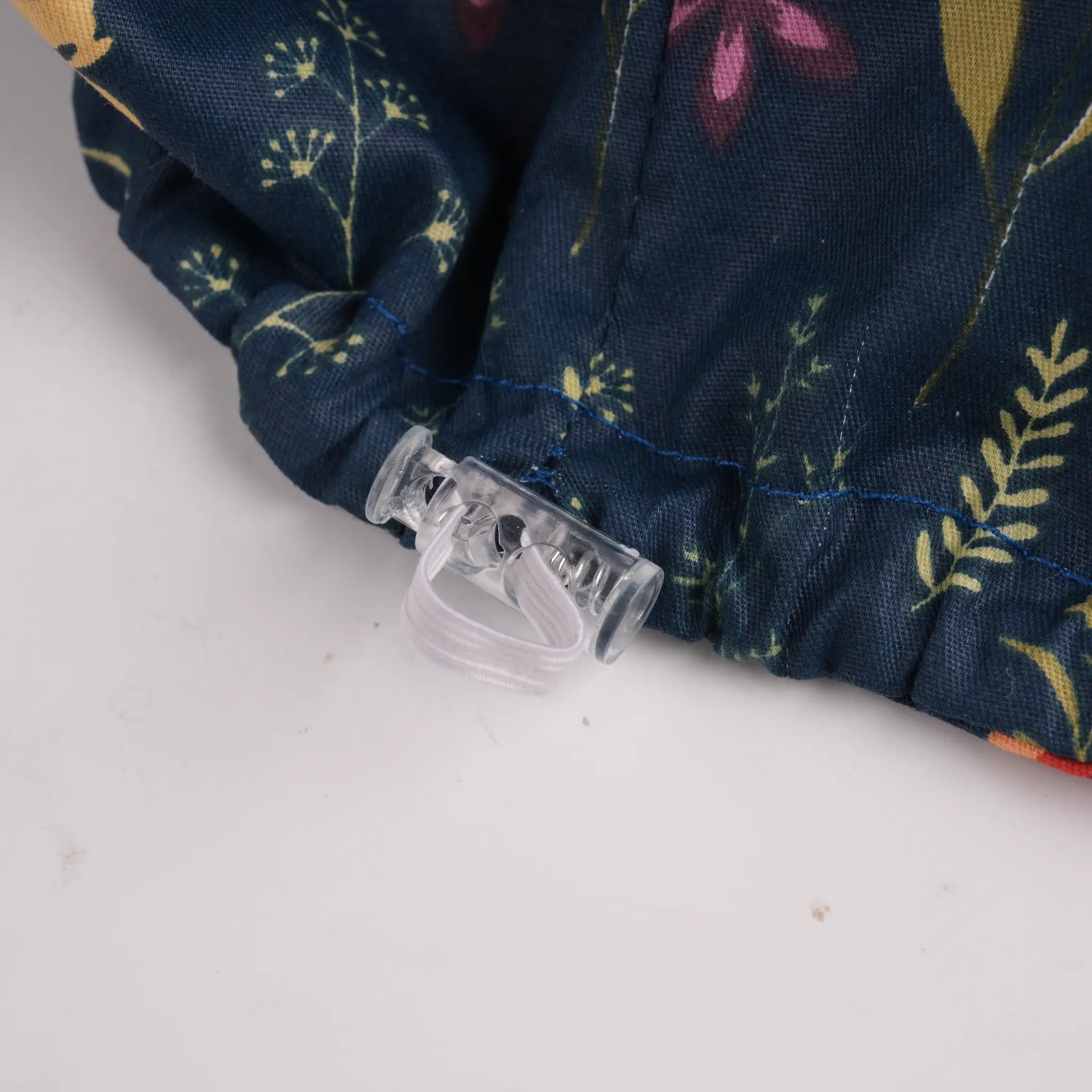 Close-up of clear plastic adjustable toggle.