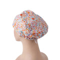 Side back view of pink flower euro scrub cap with small orange pink flowers