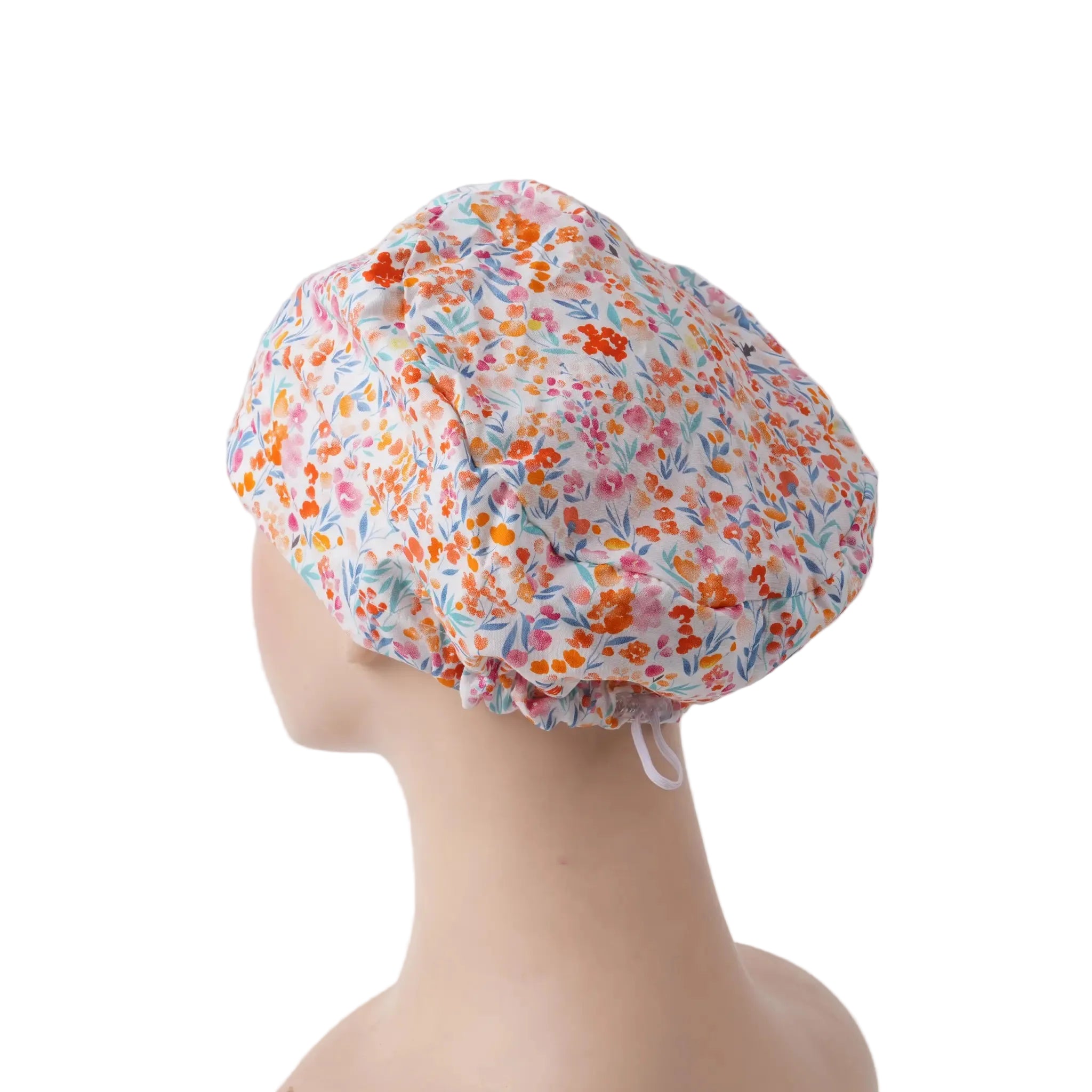 Side back view of pink flower euro scrub cap with small orange pink flowers