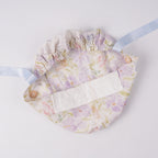 Lavender iris floral ponytail scrub cap, flat lay interior view with forehead sweatband and elastic ponytail pouch.