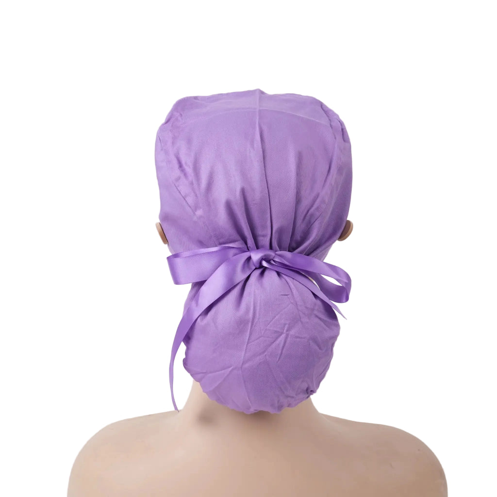 Solid purple ponytail scrub cap with ribbon tied in a bow at the back