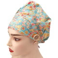 Bouffant scrub cap with gold metallic print sakura and butterflies, side view on mannequin
