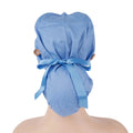 A light blue surgical scrub cap shown from the back on a mannequin head, tied with a matching blue ribbon and secured with two small brown buttons on the sides.