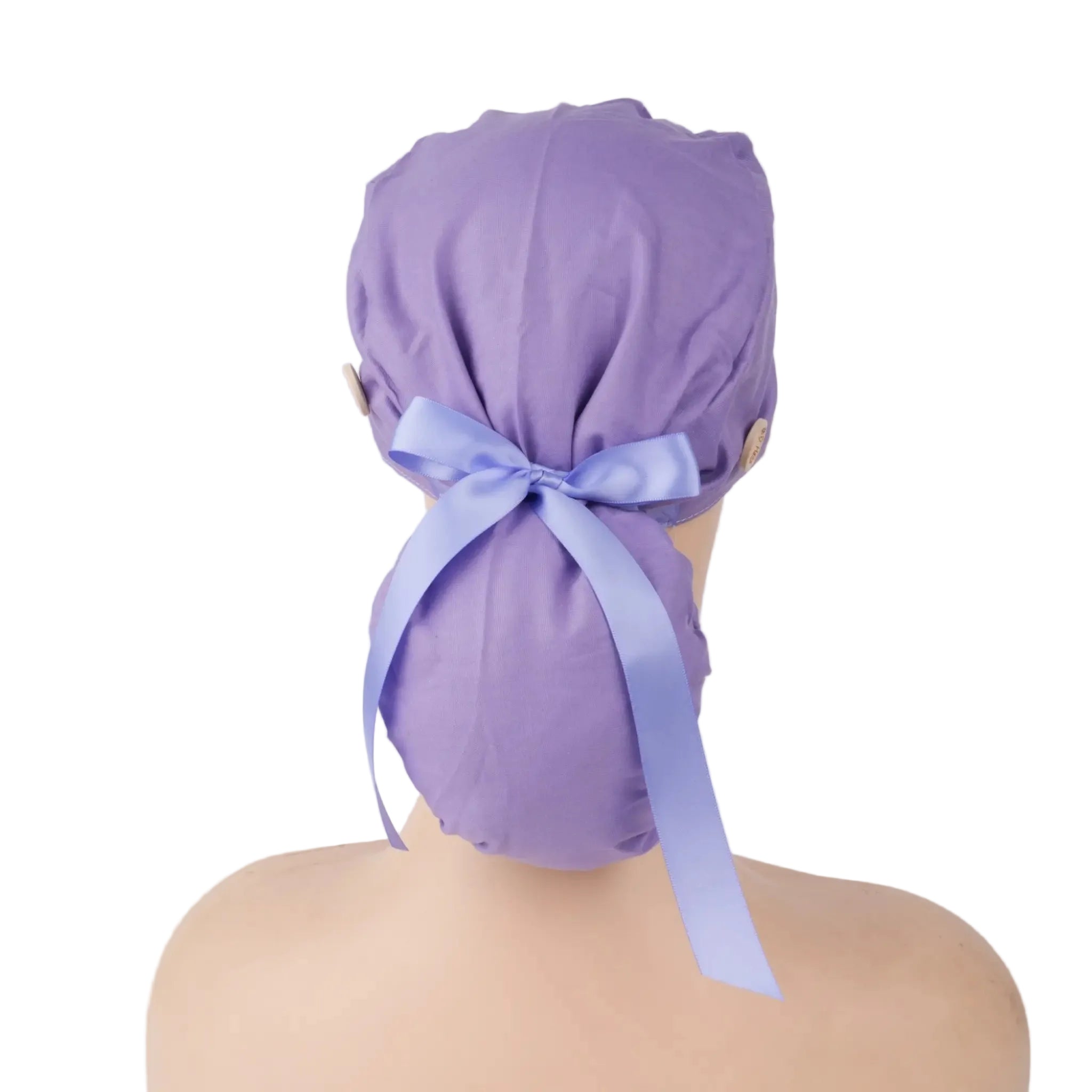 A solid light purple ponytail cap shown from the back on a mannequin head, tied with matching satin ribbon bow.