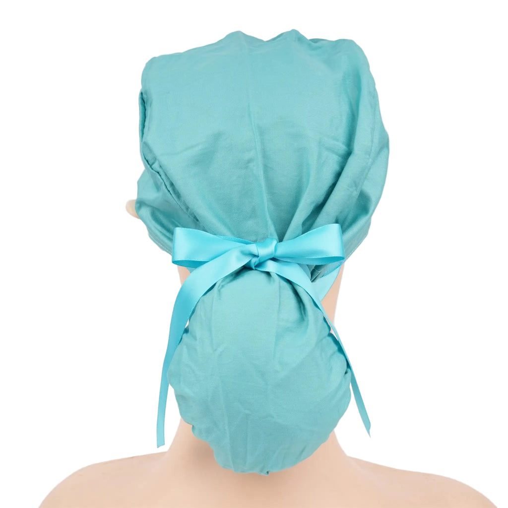 A teal ponytail surgical cap shown from the back on a mannequin head, tied with a matching color ribbon bow.