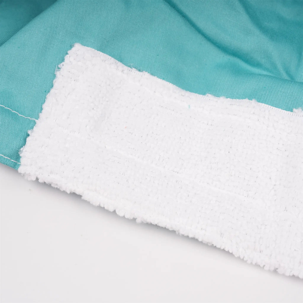 A close-up of white sweatband on solid teal scrub cap