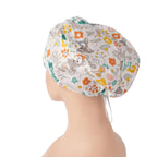 Side back view of deer scrub cap with colorful flowers
