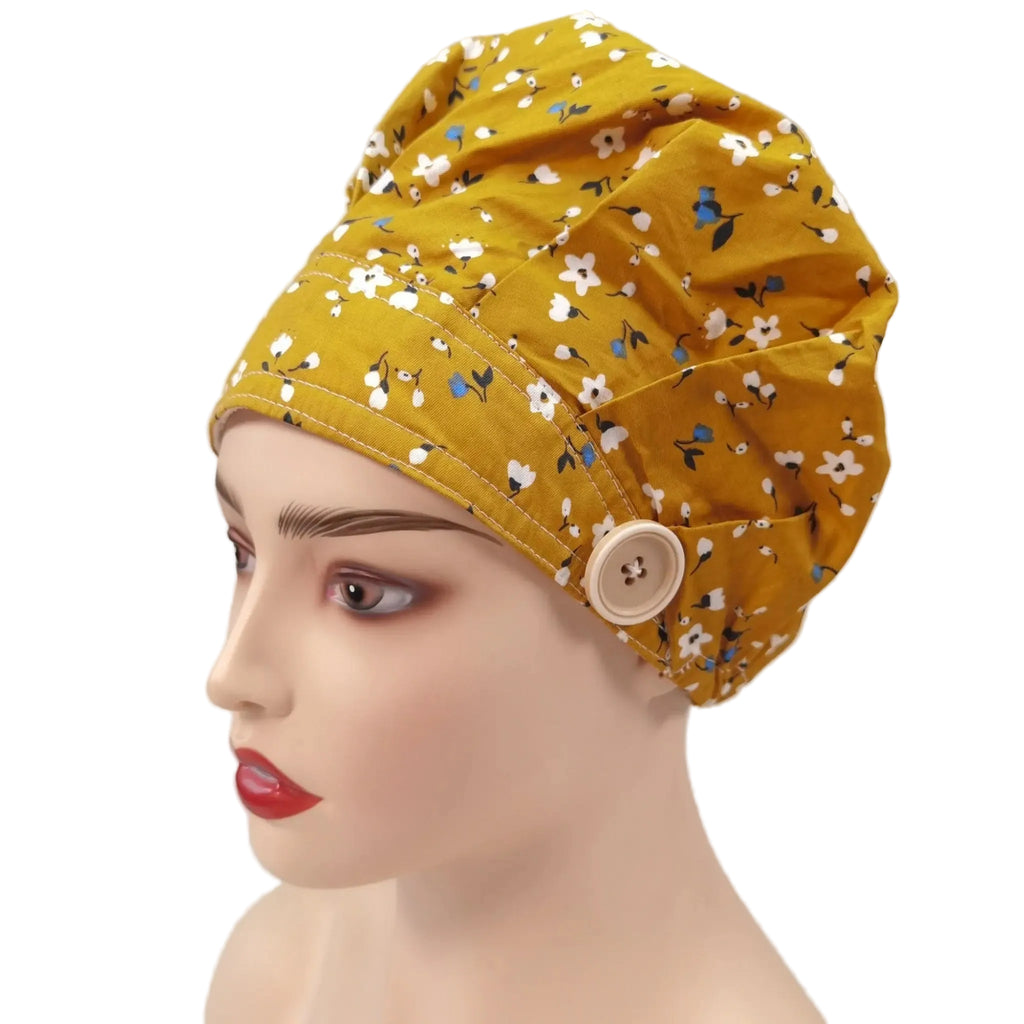 Side front view of yellow plum flowers bouffant cap on mannequin head
